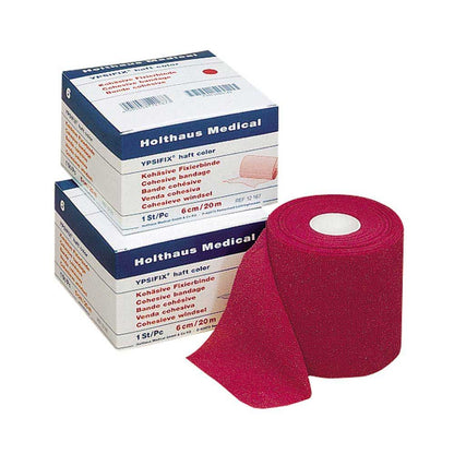 Haft-Fixierbinde YPSIFIX® in Pink als Rolle, zusammen mit Verpackung