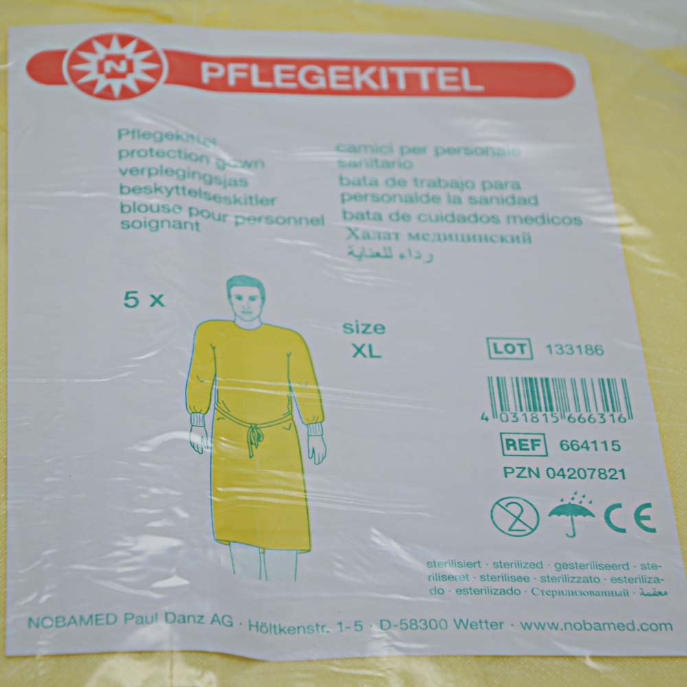 Gelber Pflegekittel aus Vliesstoff, Etikett mit Größe XL, 5×